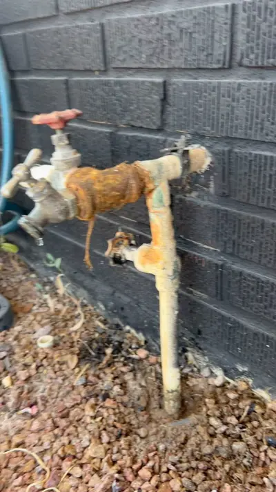 Corroded, leaking hose bib before repair.